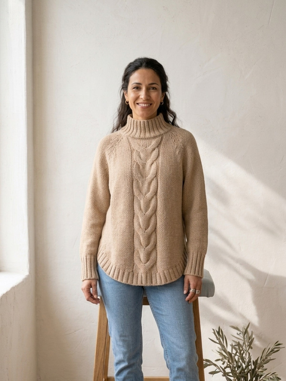Woman in her forties wearing the beige Cable-Knit Stand-Collar Jumper