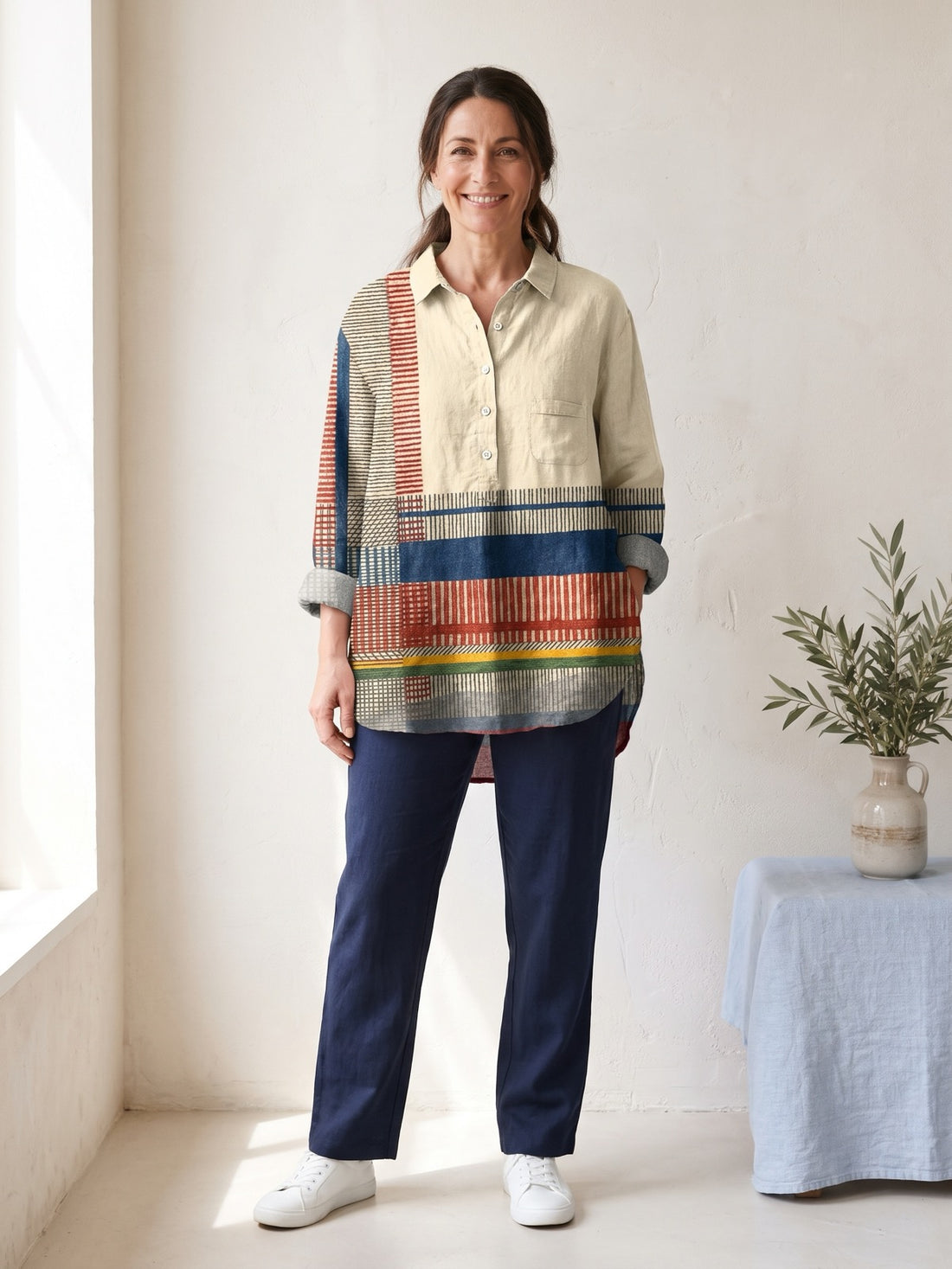 Woman in her late forties wearing the Cream Striped Patchwork Shirt with navy trousers