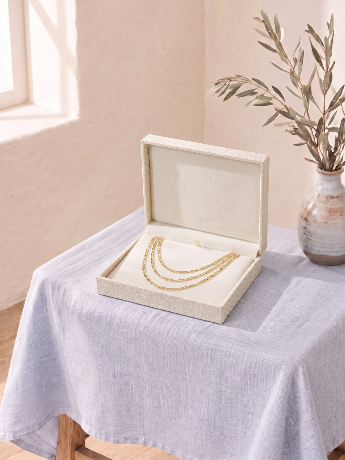 Gold Layered Chain Necklace in an open jewellery box