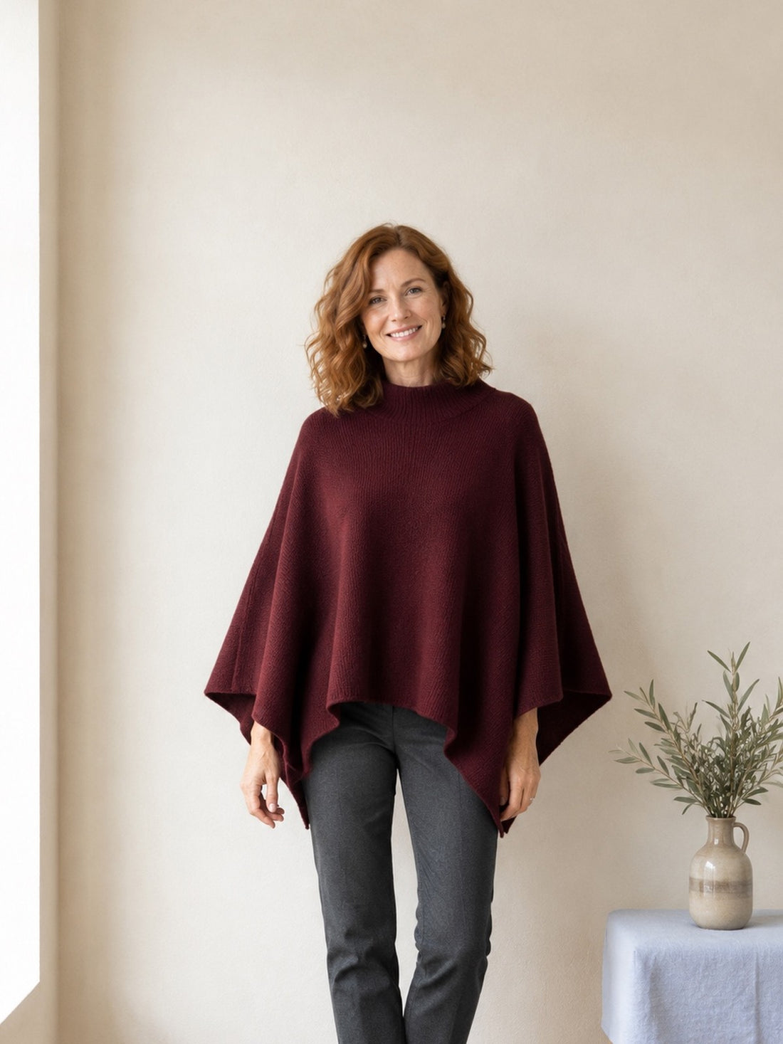 Woman wearing the burgundy Knitted Wrap Poncho