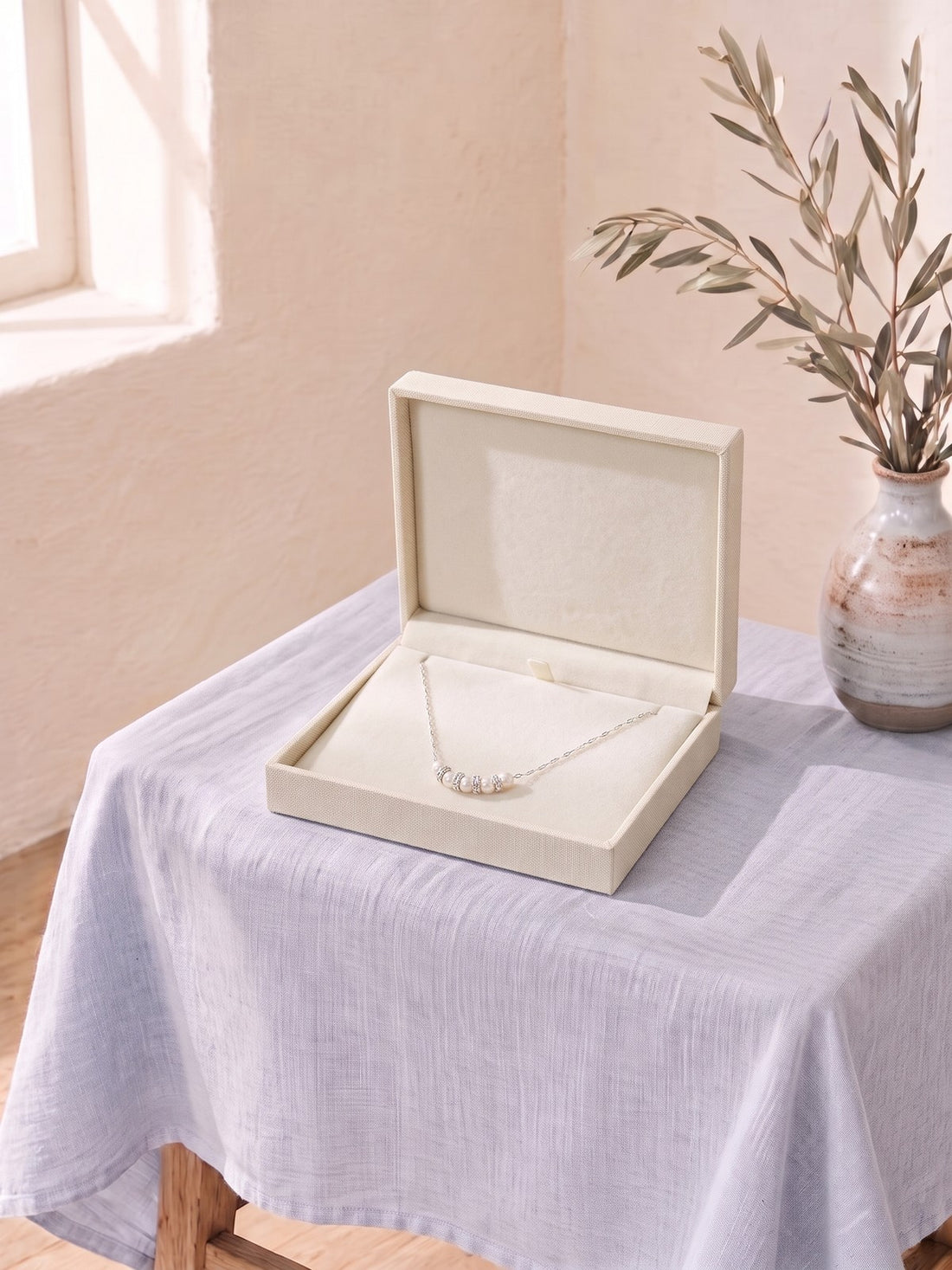 Silver Pearl Cluster Necklace in an open jewellery box