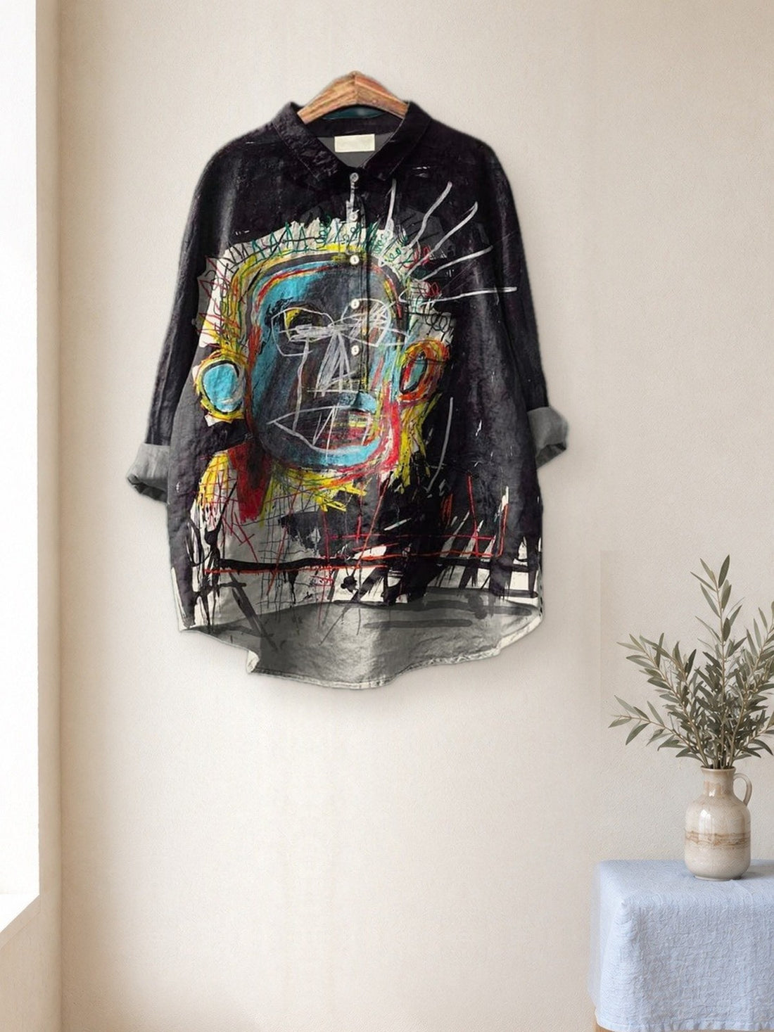 Black Art Print Shirt hanging in a bright studio