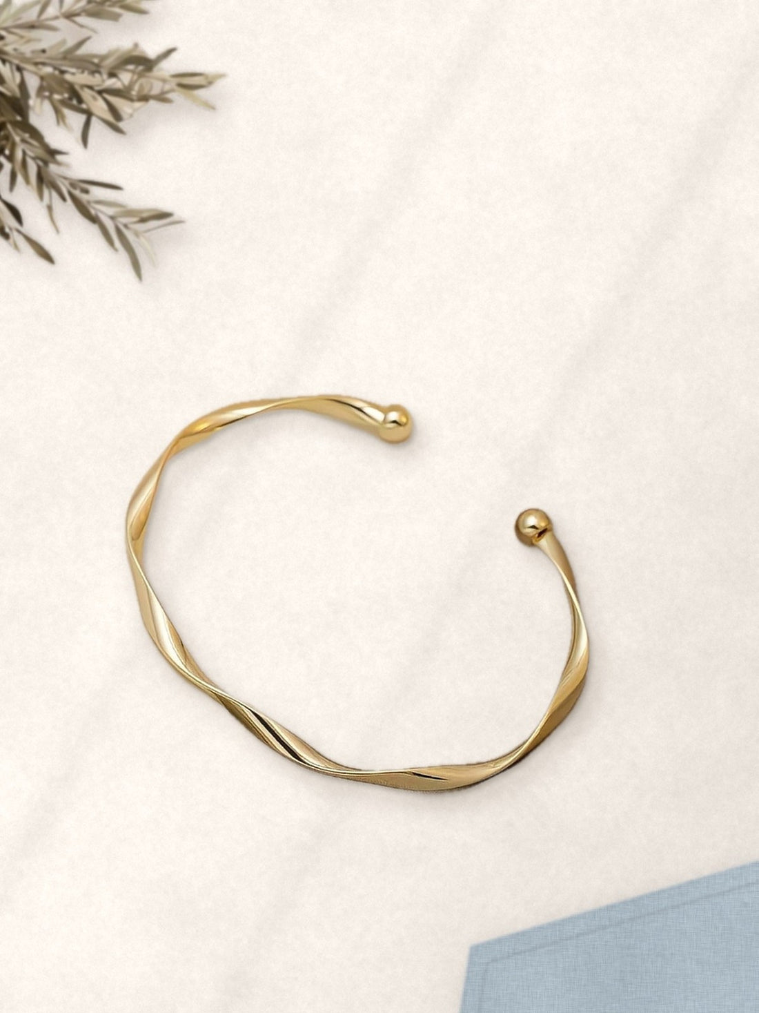 Gold Twisted Bangle Bracelet laid flat