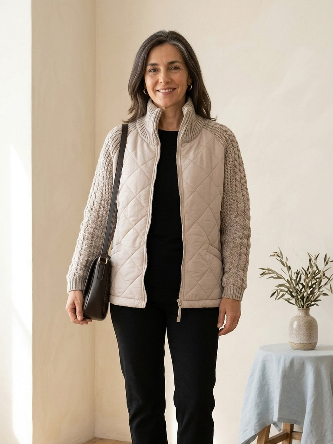 Woman in her fifties wearing the beige Quilted Jacket with Cable-Knit Sleeves