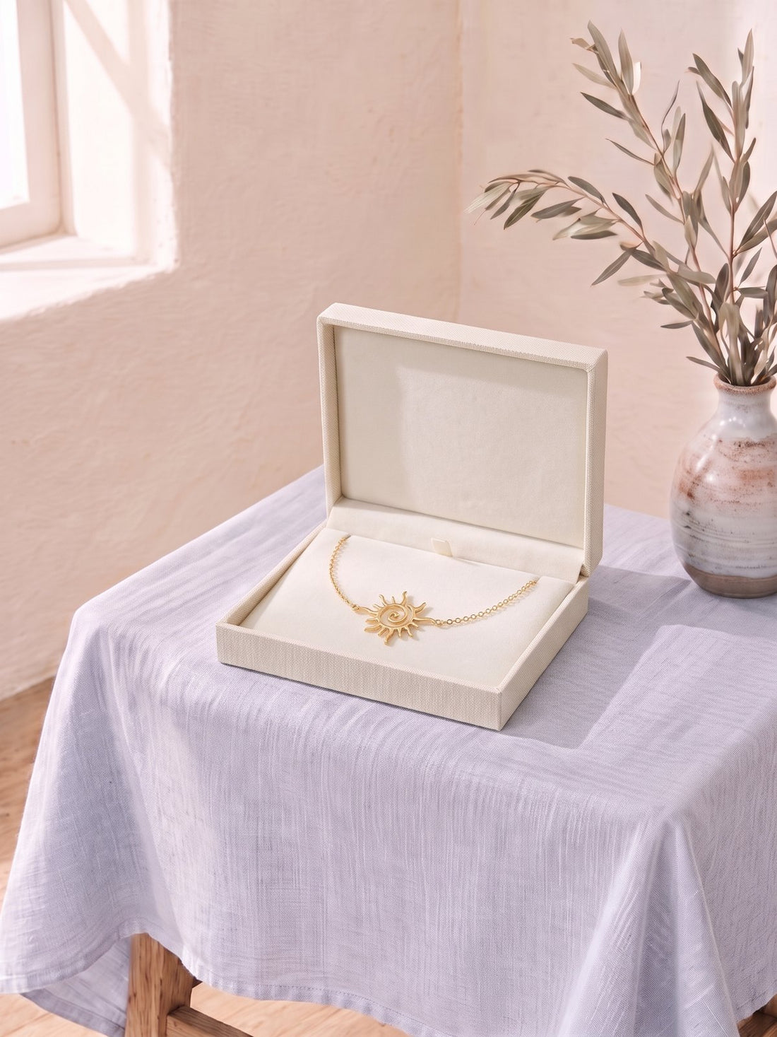 Sunburst Gold Bracelet in a cream jewellery box